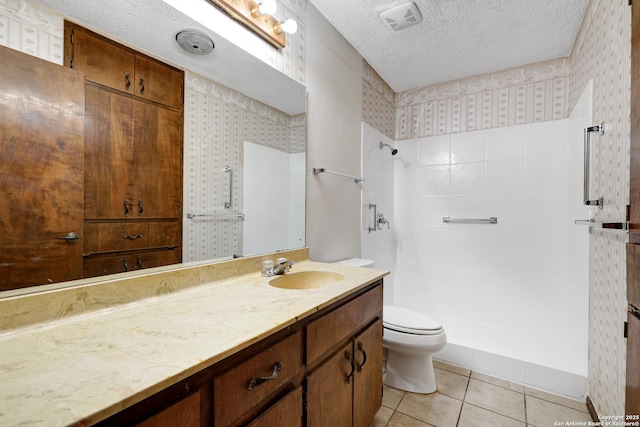 full bath featuring visible vents, toilet, vanity, a textured ceiling, and tile patterned floors