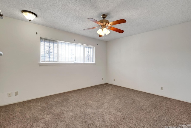 carpeted empty room with a ceiling fan and a textured ceiling