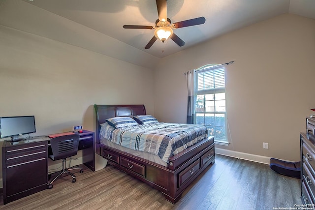 bedroom with dark wood-type flooring, lofted ceiling, baseboards, and a ceiling fan