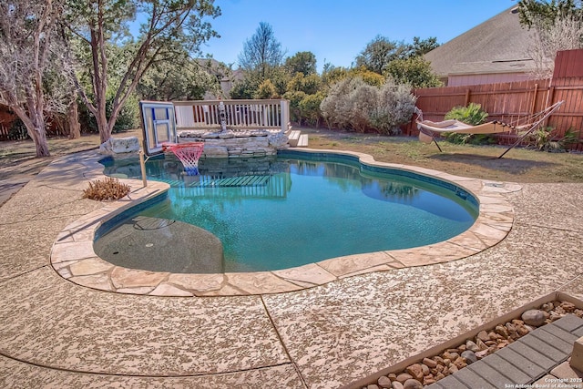 view of pool featuring a fenced in pool, a patio area, and fence