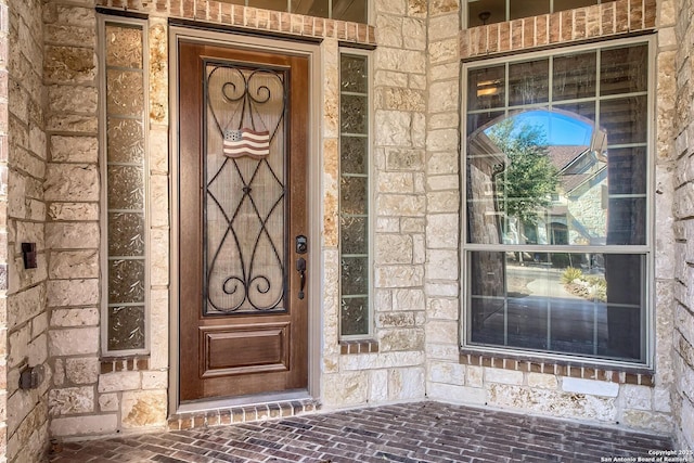 view of exterior entry with stone siding