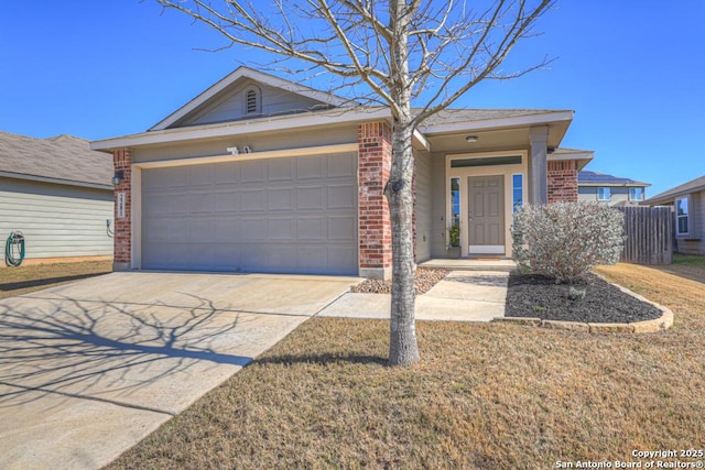 ranch-style house featuring a garage, a front yard, brick siding, and driveway