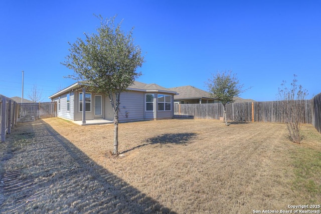 view of yard featuring a fenced backyard and a patio