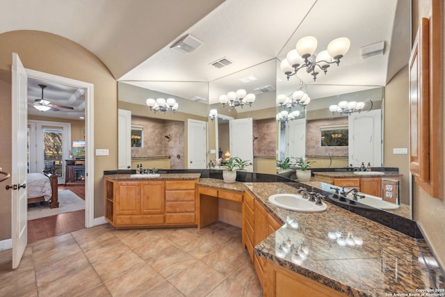 ensuite bathroom with connected bathroom, visible vents, a sink, and ceiling fan