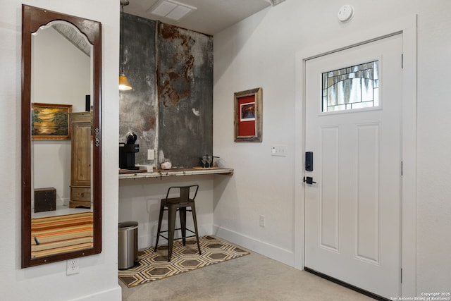 foyer with visible vents and baseboards