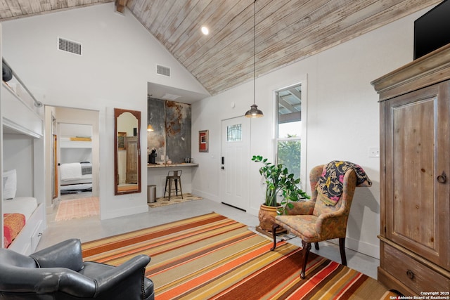 interior space with wood ceiling, high vaulted ceiling, visible vents, and baseboards