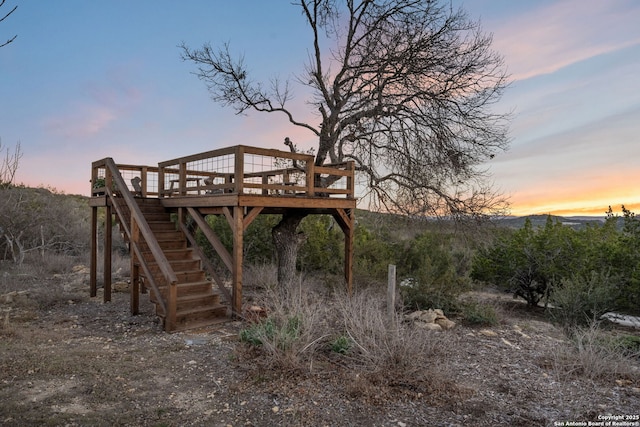 exterior space with stairway and a wooden deck