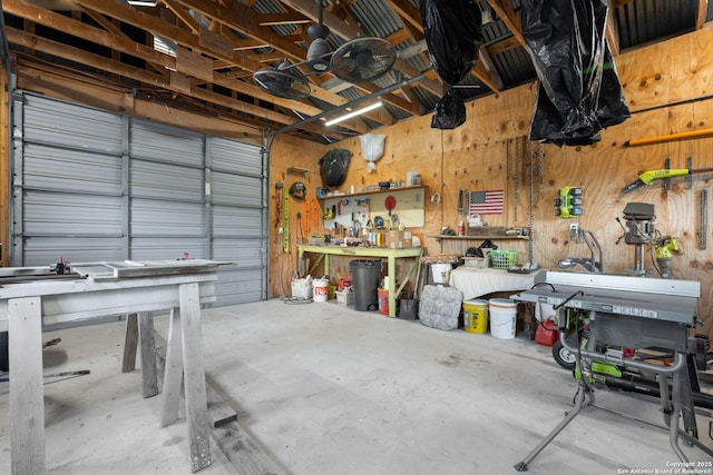 garage with metal wall and a workshop area