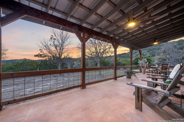 view of patio featuring a view of trees