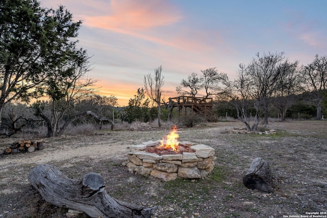 view of yard with an outdoor fire pit