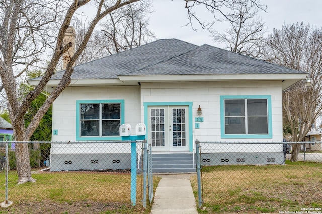 bungalow-style home featuring crawl space, a shingled roof, and french doors