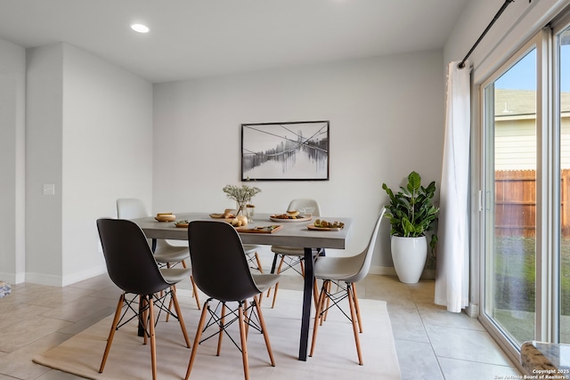 dining space featuring recessed lighting, baseboards, and light tile patterned floors