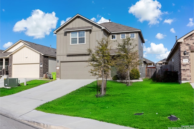 view of front of home with driveway, fence, a front lawn, and board and batten siding