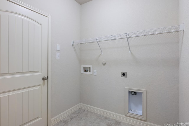 clothes washing area with hookup for a washing machine, hookup for a gas dryer, laundry area, baseboards, and electric dryer hookup