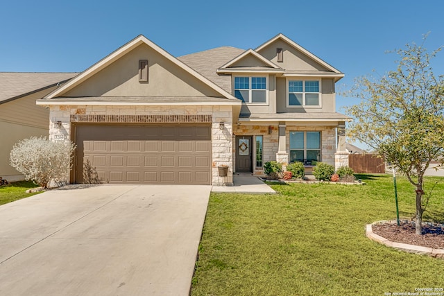 craftsman inspired home featuring an attached garage, a front yard, fence, stone siding, and driveway