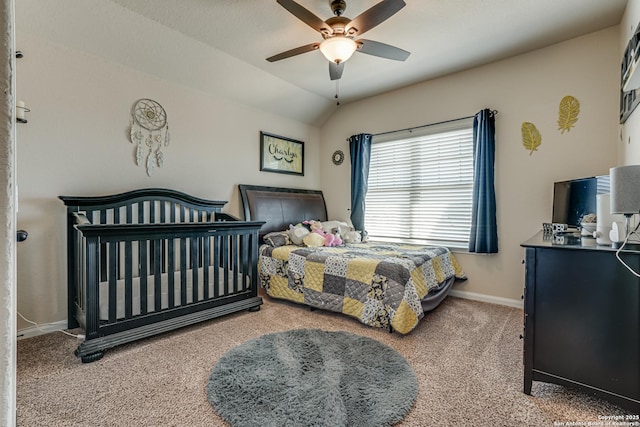 carpeted bedroom featuring a ceiling fan, vaulted ceiling, and baseboards