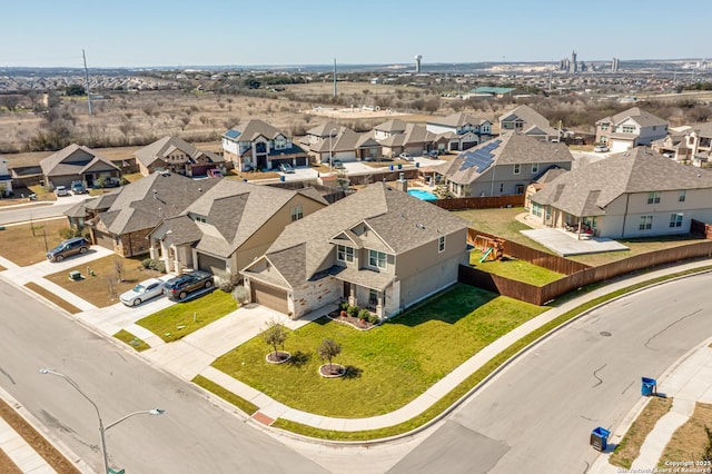 birds eye view of property with a residential view