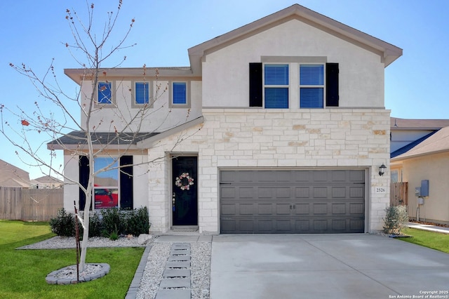 view of front of home featuring stucco siding, concrete driveway, an attached garage, a front yard, and fence