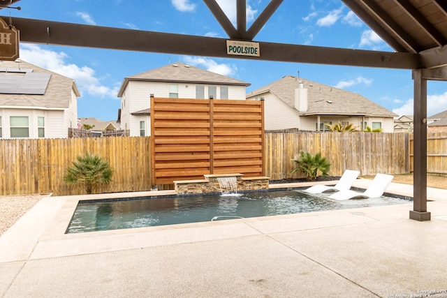 view of swimming pool with a fenced in pool, a fenced backyard, and a patio