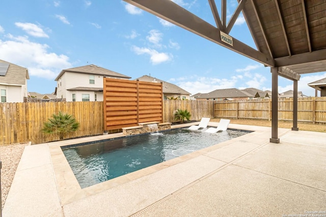 view of swimming pool featuring a patio area and a fenced backyard