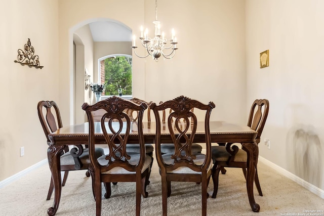 846 County Road 2763, Mico, TX 78056 - dining area featuring arched walkways, light colored carpet, baseboards, and an inviting chandelier