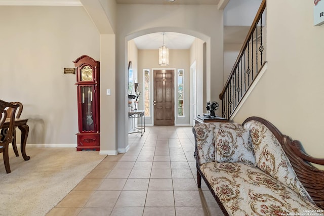846 County Road 2763, Mico, TX 78056 - foyer entrance with arched walkways, light tile patterned floors, light colored carpet, stairway, and baseboards