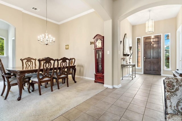 846 County Road 2763, Mico, TX 78056 - carpeted dining area featuring a chandelier, arched walkways, tile patterned flooring, visible vents, and ornamental molding