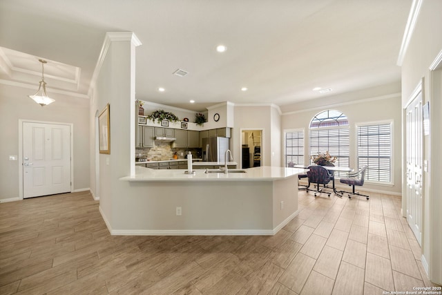 kitchen with light countertops, gray cabinetry, light wood-style floors, a sink, and stainless steel fridge with ice dispenser