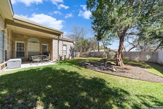 view of yard with a patio area and a fenced backyard