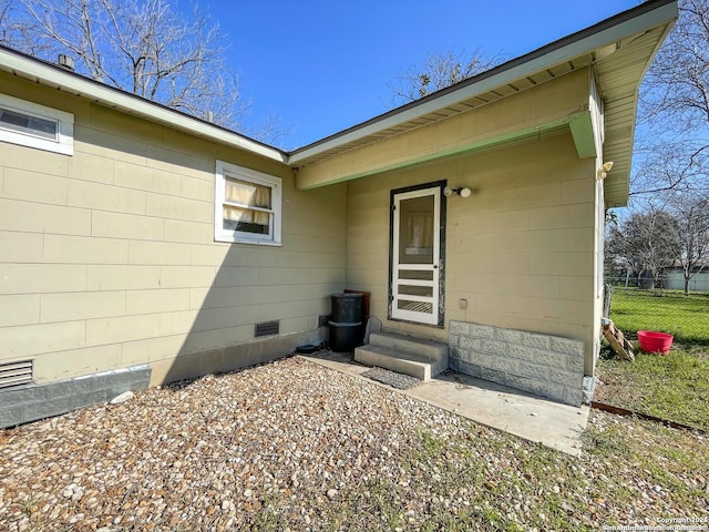 view of exterior entry featuring crawl space