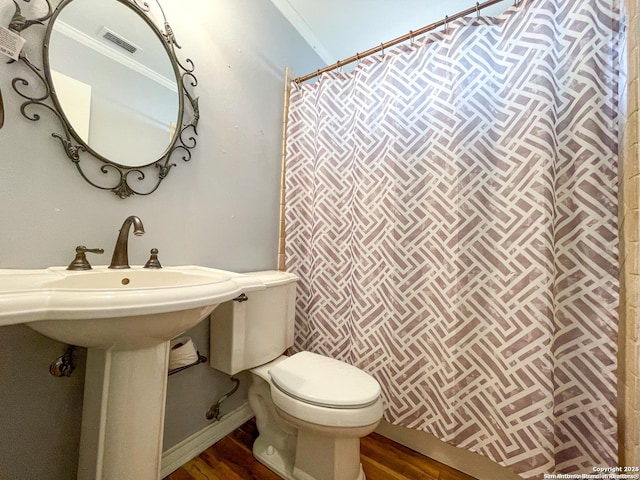 full bath featuring visible vents, wood finished floors, toilet, and baseboards