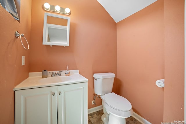 232 Hobart, San Antonio, TX 78237 - bathroom with toilet, lofted ceiling, vanity, and baseboards