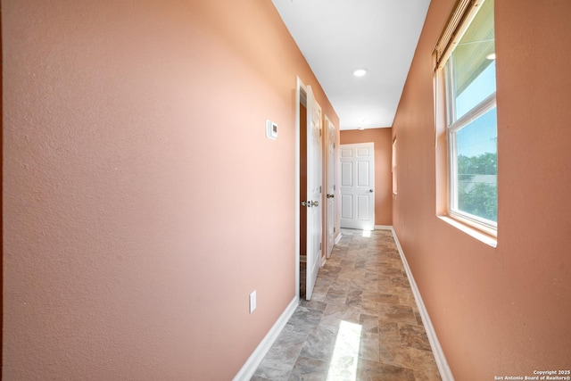 232 Hobart, San Antonio, TX 78237 - hallway featuring stone finish flooring and baseboards