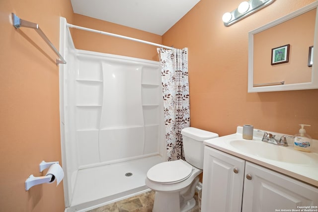 232 Hobart, San Antonio, TX 78237 - full bathroom with vanity, toilet, a shower stall, and stone finish flooring