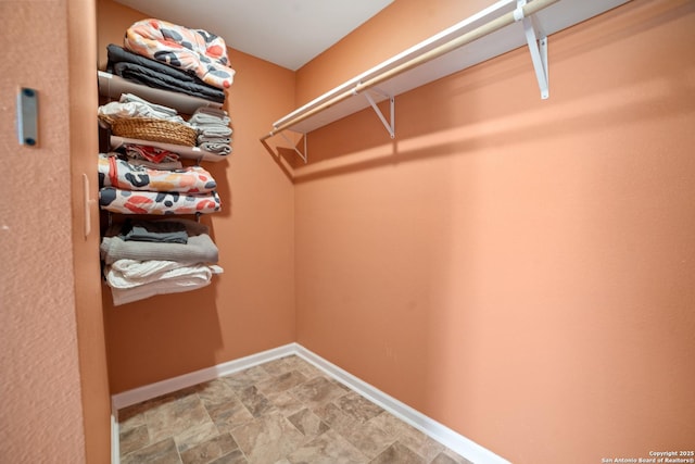232 Hobart, San Antonio, TX 78237 - walk in closet with stone finish floors