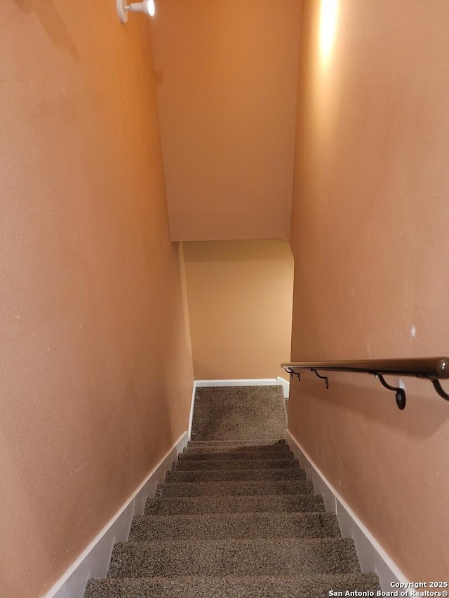 stairs with carpet and baseboards