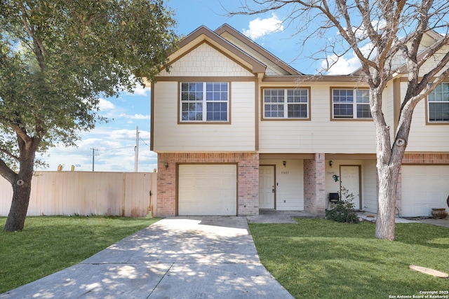 townhome / multi-family property featuring a garage, brick siding, driveway, and a front lawn