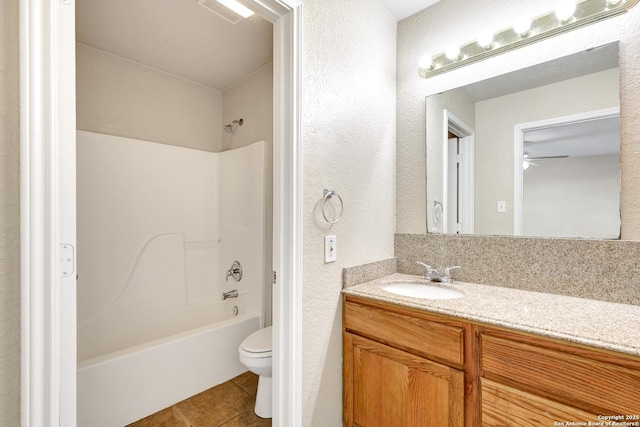 bathroom with bathing tub / shower combination, visible vents, toilet, vanity, and tile patterned floors