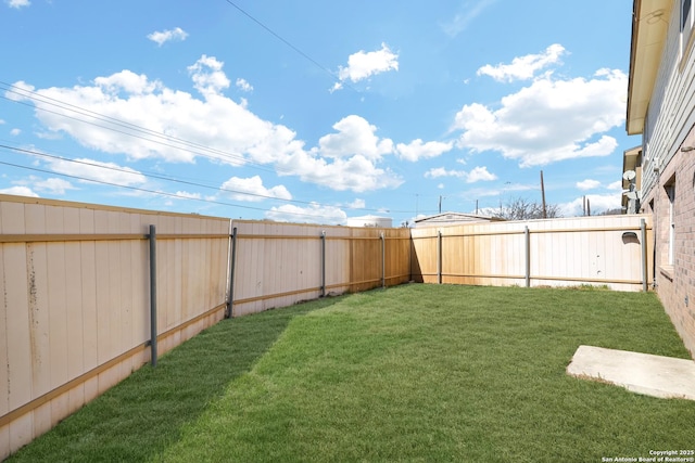 view of yard featuring a fenced backyard