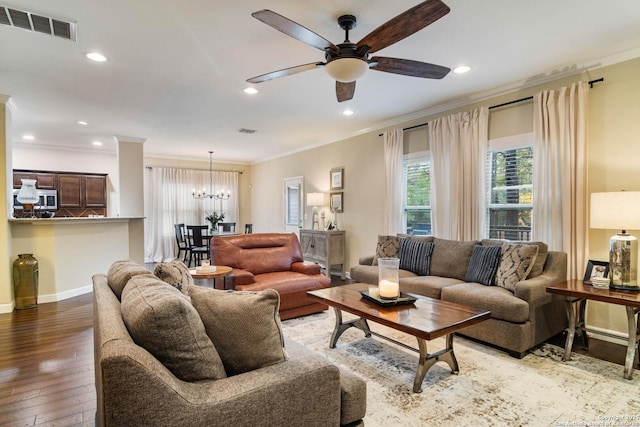 living room featuring recessed lighting, visible vents, ornamental molding, baseboards, and hardwood / wood-style flooring