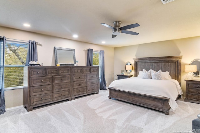 bedroom with recessed lighting, baseboards, a ceiling fan, and light colored carpet