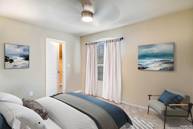 bedroom with carpet floors, ceiling fan, and baseboards