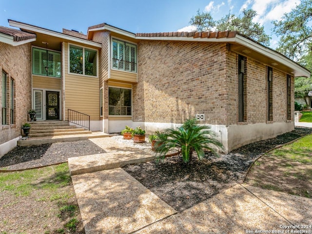 exterior space with brick siding