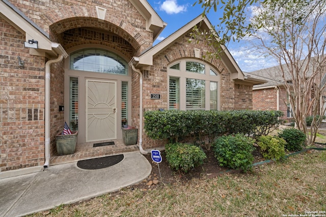 entrance to property with brick siding