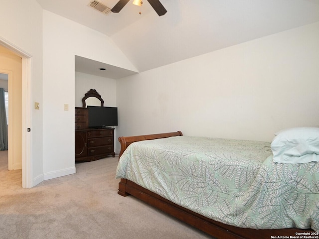 carpeted bedroom featuring lofted ceiling, a ceiling fan, visible vents, and baseboards