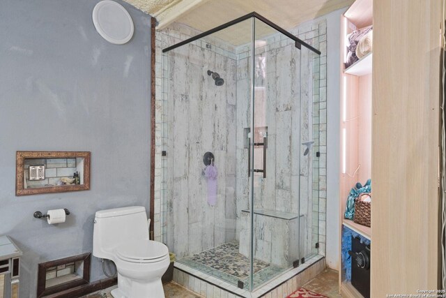 full bathroom with a shower stall and toilet