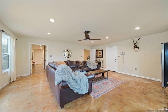 living area with recessed lighting, concrete floors, baseboards, and ceiling fan