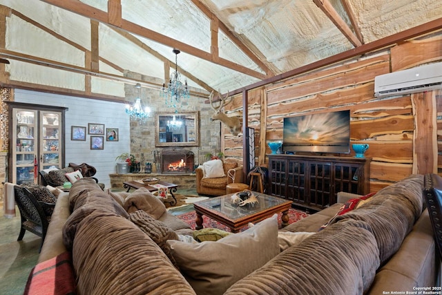 living area with a fireplace, an inviting chandelier, wooden walls, high vaulted ceiling, and a wall mounted air conditioner