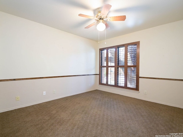 unfurnished room with ceiling fan and carpet flooring