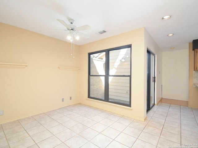 spare room featuring baseboards, visible vents, a ceiling fan, light tile patterned flooring, and recessed lighting